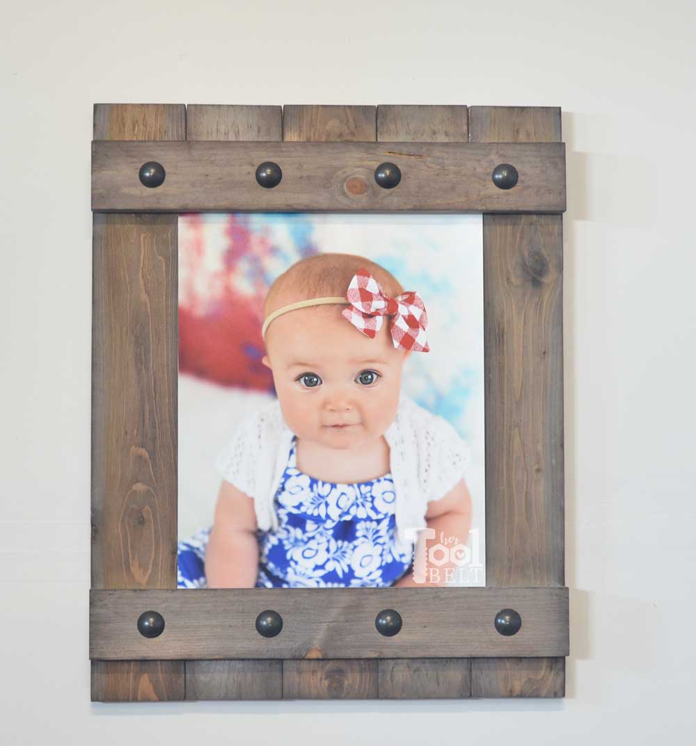 Change out your photo prints super easy with a sliding farmhouse style frame. Make these cute frames out of wood for as little as $5. Free plans