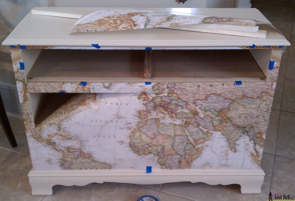 Make over an old dresser into a unique travel theme map dresser with a map and mod podge!