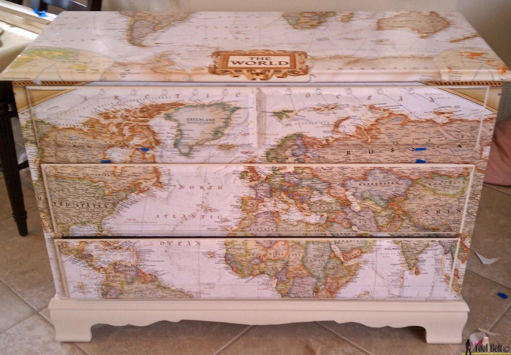 Make over an old dresser into a unique travel theme map dresser with a map and mod podge!