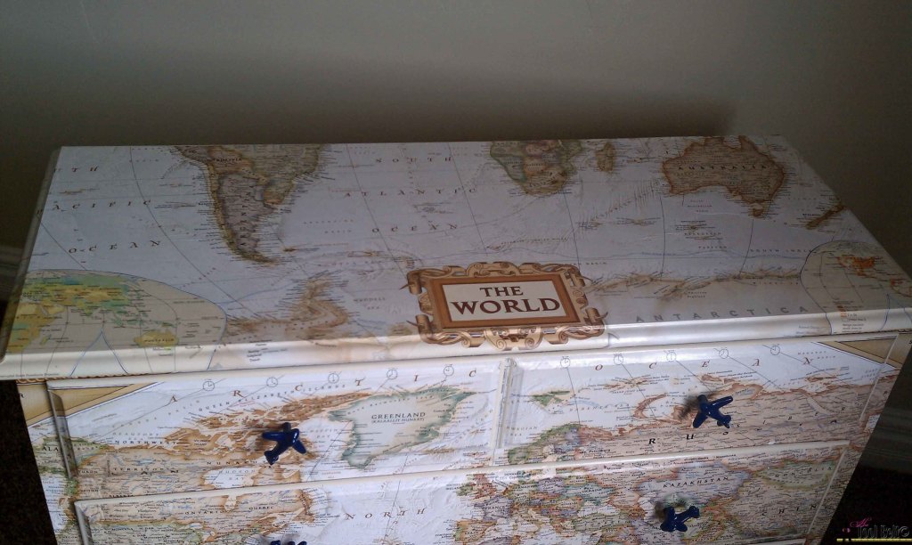Make over an old dresser into a unique travel theme map dresser with a map and mod podge!