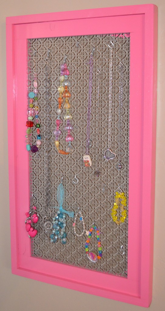 Build a simple stacked wood frame to make a cool jewelry display frame.