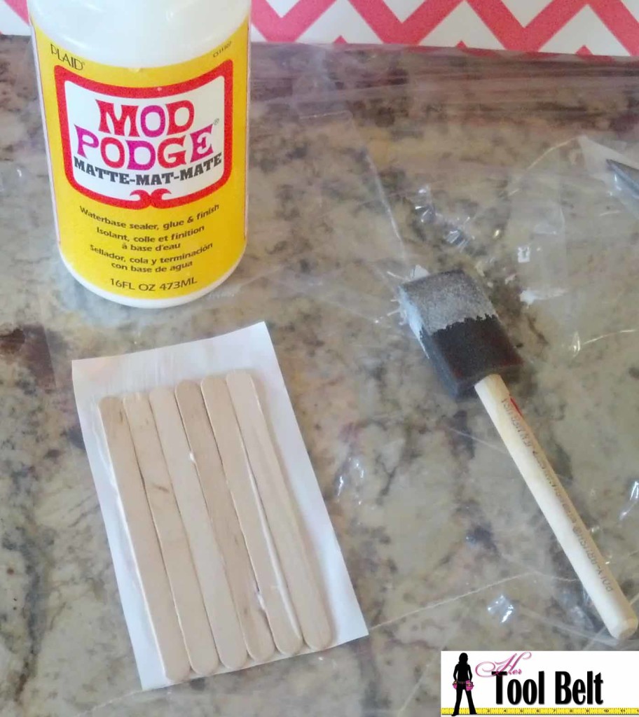 mod podge paper onto sticks