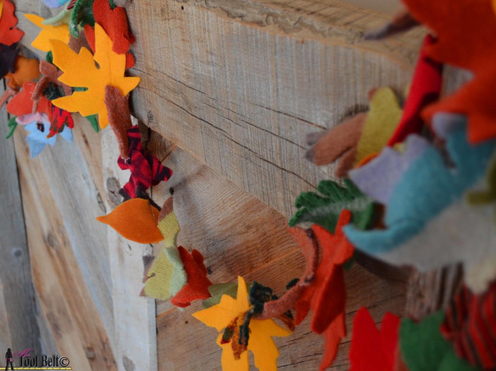 Super easy fall garland from recycled sweaters and felt. #falldecorations #fallcrafts #hertoolbelt