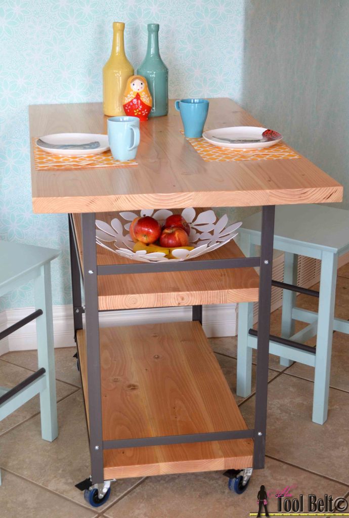 Build a stylish DIY multi-functional table. Free plans for a rolling industrial counter table, rolling island with lots of open storage.