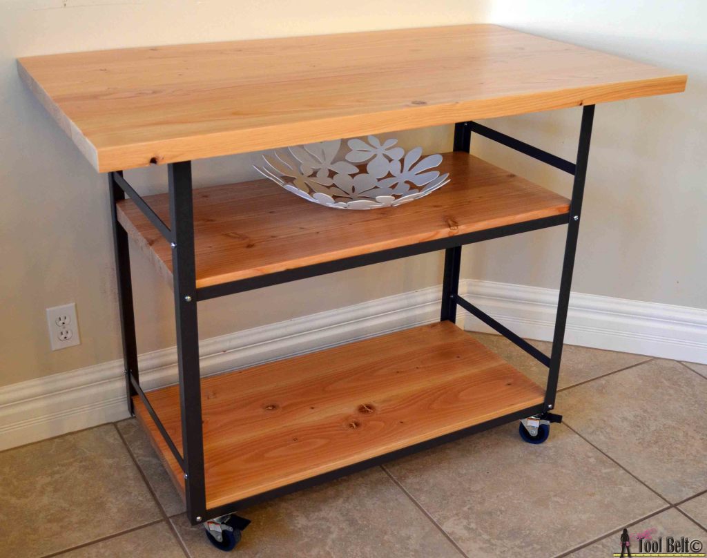 Build a stylish DIY multi-functional table. Free plans for a rolling industrial counter table, rolling island with lots of open storage.