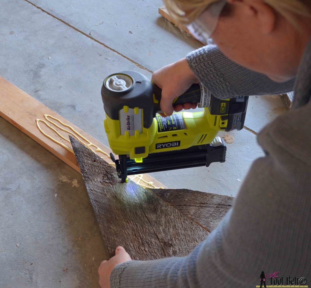 An easy way to add natural elements into your Christmas decor, build a rustic Christmas Tree from pallets or barn wood.