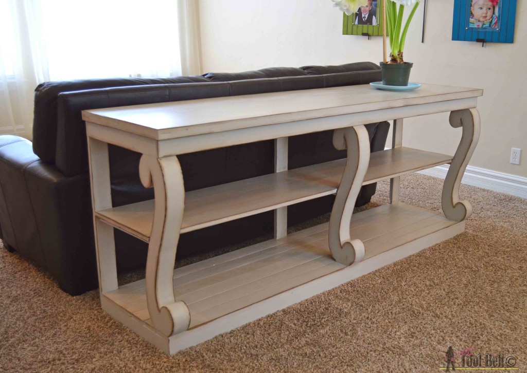 Build a console table with awesome scroll legs, definitely a statement piece! Free woodworking plans.