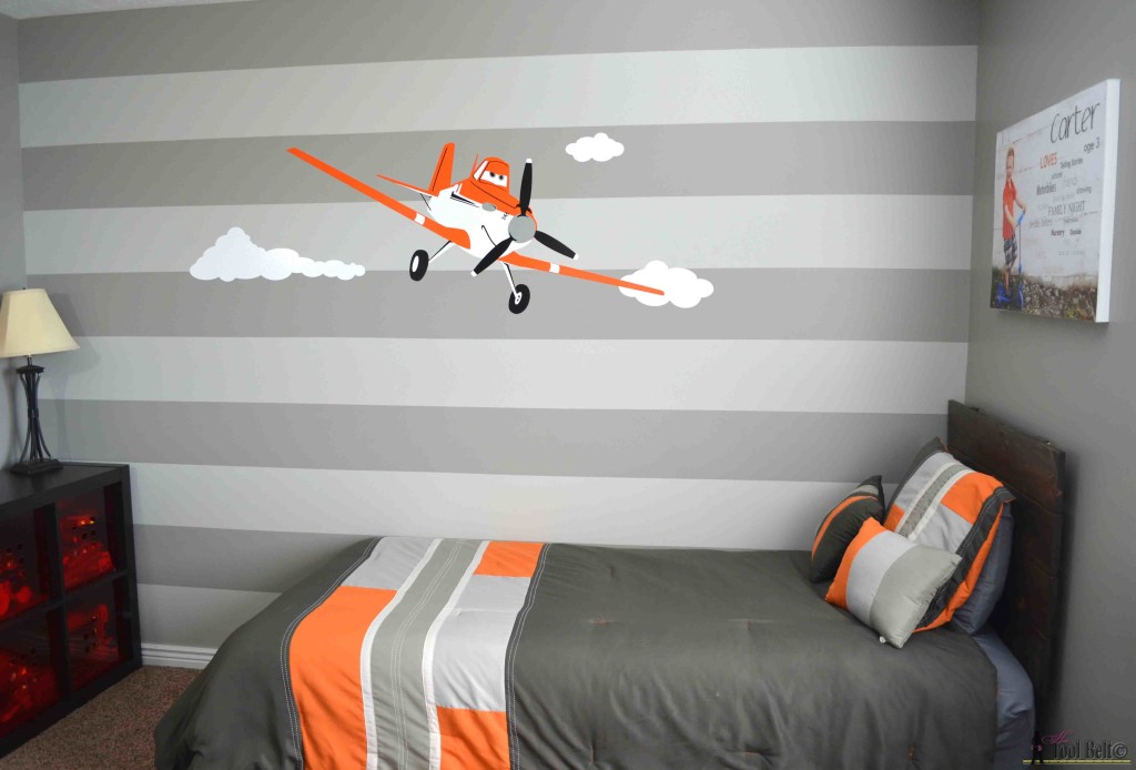Super cute gray and orange boys room inspired by racing legend Dusty!  Free woodworking plans for an easy DIY - simple headboard.