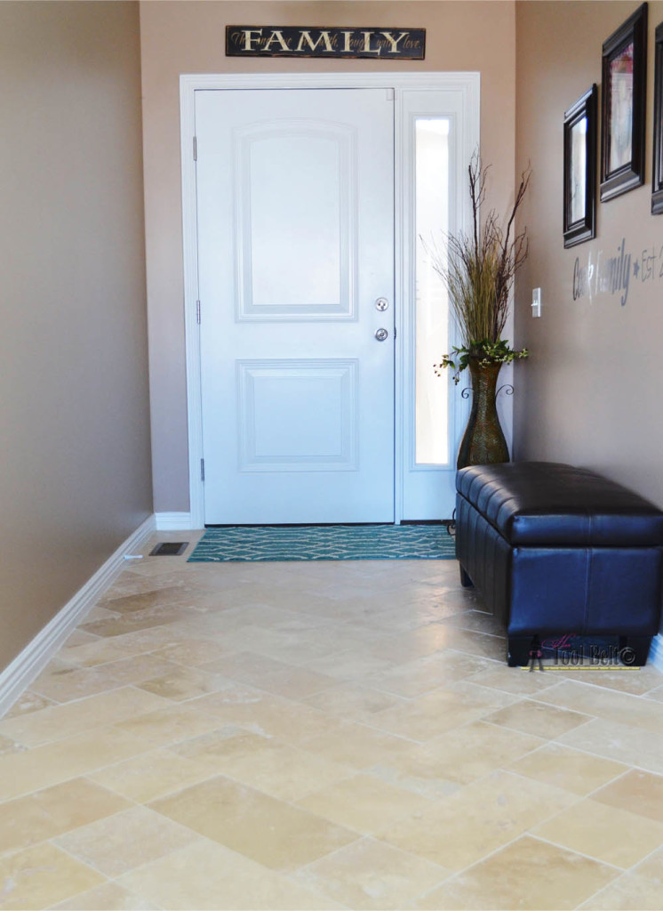 DIY beautiful travertine tile floors in a pattern (herringbone inserted) to make your budget floors look extraordinary. 