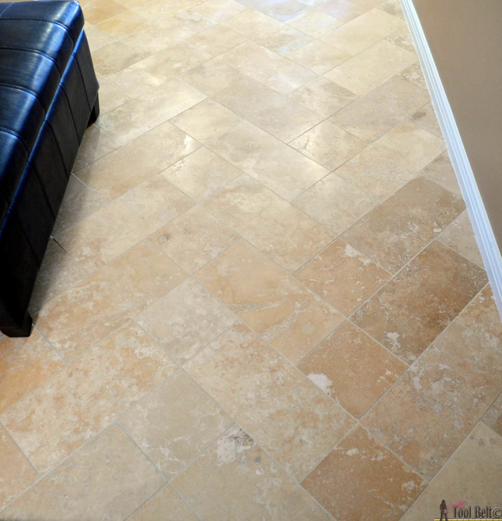 DIY beautiful travertine tile floors in a pattern (herringbone inserted) to make your budget floors look extraordinary. 