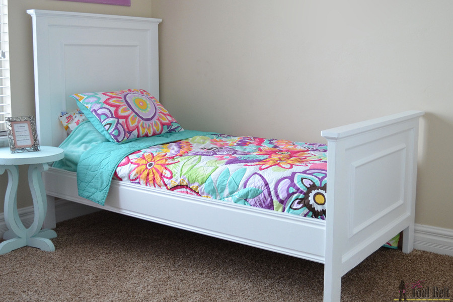 This twin bed is so easy to DIY. Add a little molding to create a faux raised panel look. Free twin bed plans. 