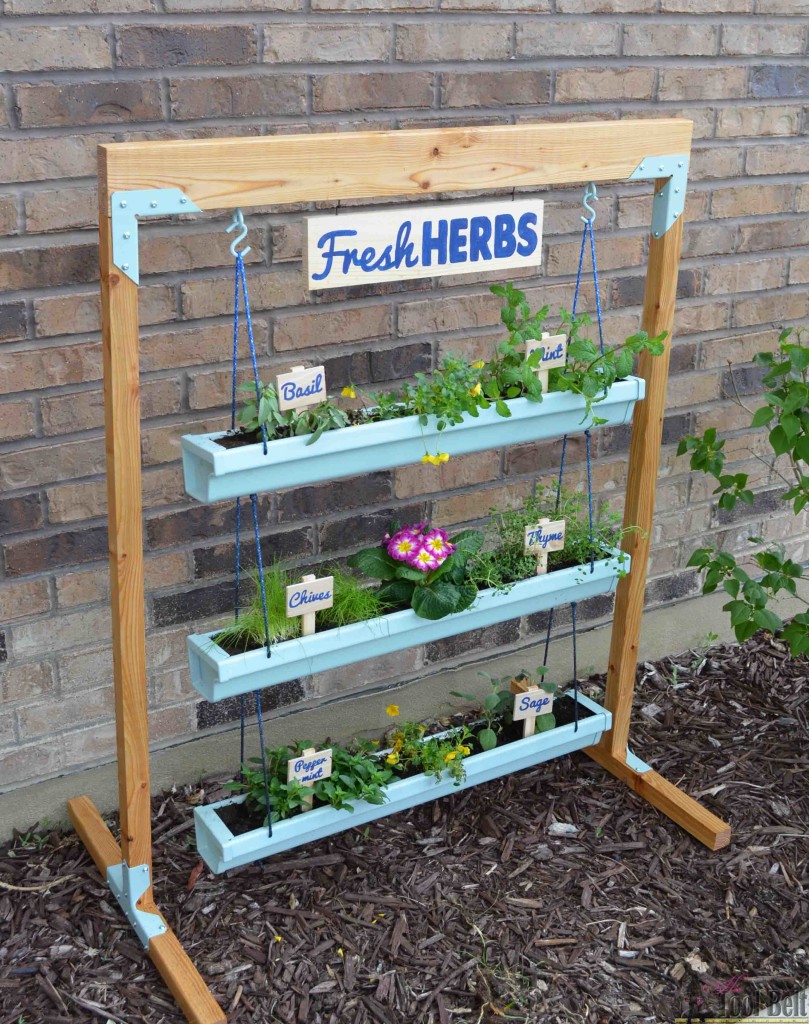 Super easy fresh herb garden that I can move around. Free plans to build a hanging gutter planter and stand. #DIHworkshop