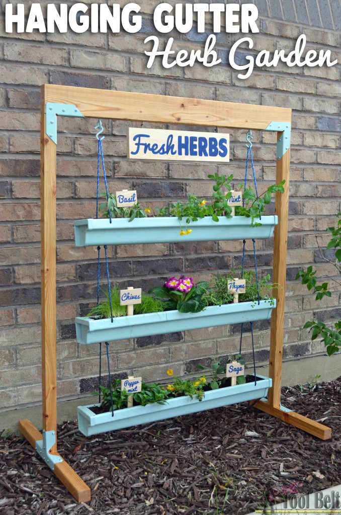 Super easy fresh herb garden that I can move around. Free plans to build a hanging gutter planter and stand. #DIHworkshop