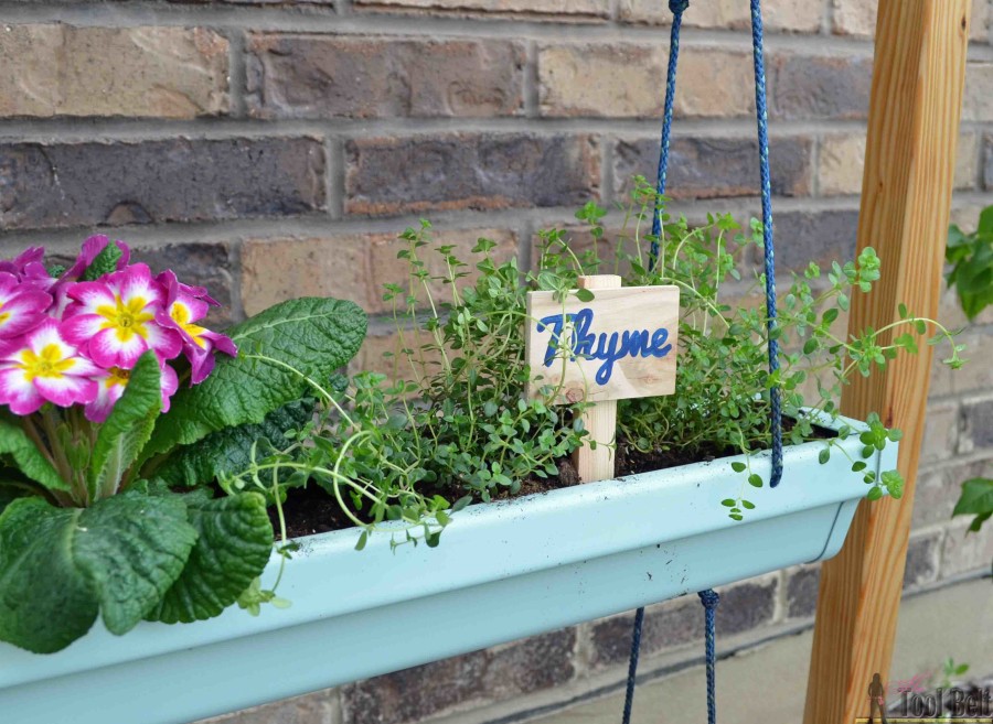 Super easy fresh herb garden that I can move around. Free plans to build a hanging gutter planter and stand. #DIHworkshop