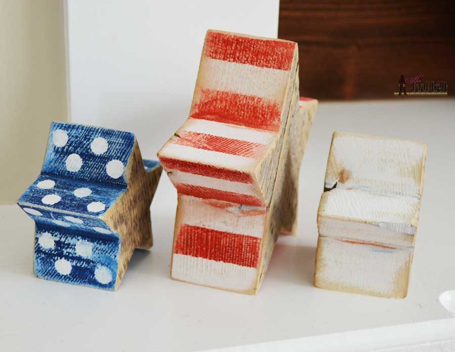 Super easy wood craft using chunky reclaimed wood (barn wood). Distressed red, white and blue star blocks with free pattern and simple tutorial.