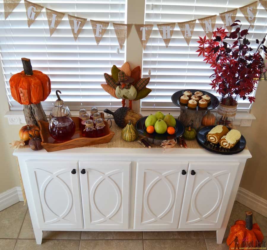 DIY Buffet or Sideboard with circle trim doors. This buffet cabinet boasts plenty of dining/kitchen supply storage. Free building plans.