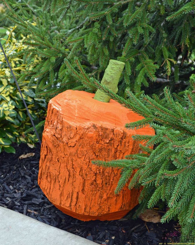 Make a simple and rustic 'Stump Pumpkin' or 'Log Pumpkin' from a wood stump. Use a chain saw to cut a simple chamfer along the top and bottom of a log for one pumpkin look. Add ribs around the stump for a more detailed rustic pumpkin. Cheap and cute Fall or Halloween craft.