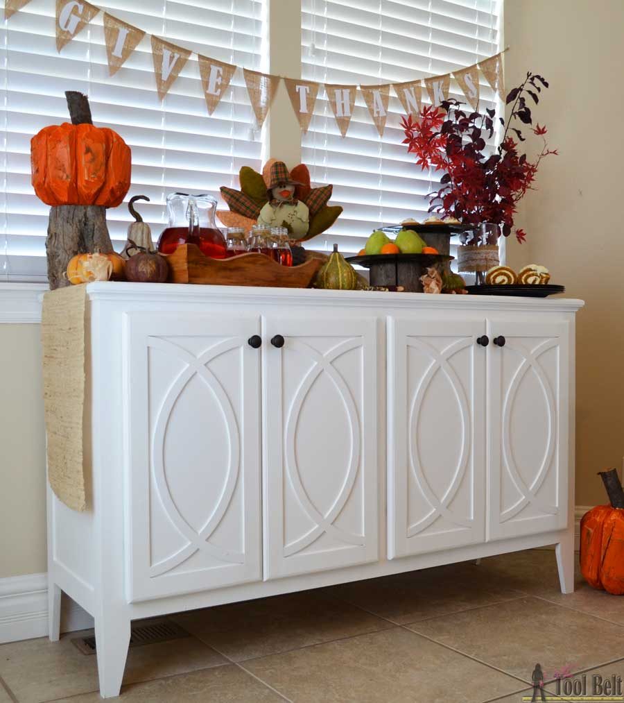 DIY Buffet or Sideboard with circle trim doors. This buffet cabinet boasts plenty of dining/kitchen supply storage. Free building plans.