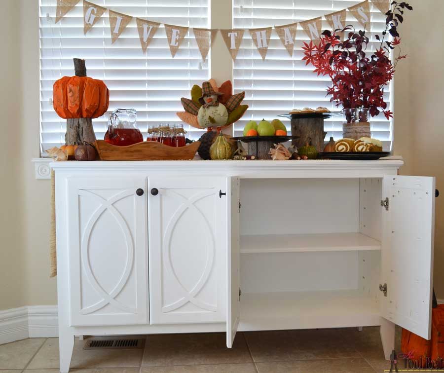 DIY Buffet or Sideboard with circle trim doors. This buffet cabinet boasts plenty of dining/kitchen supply storage. Free building plans.