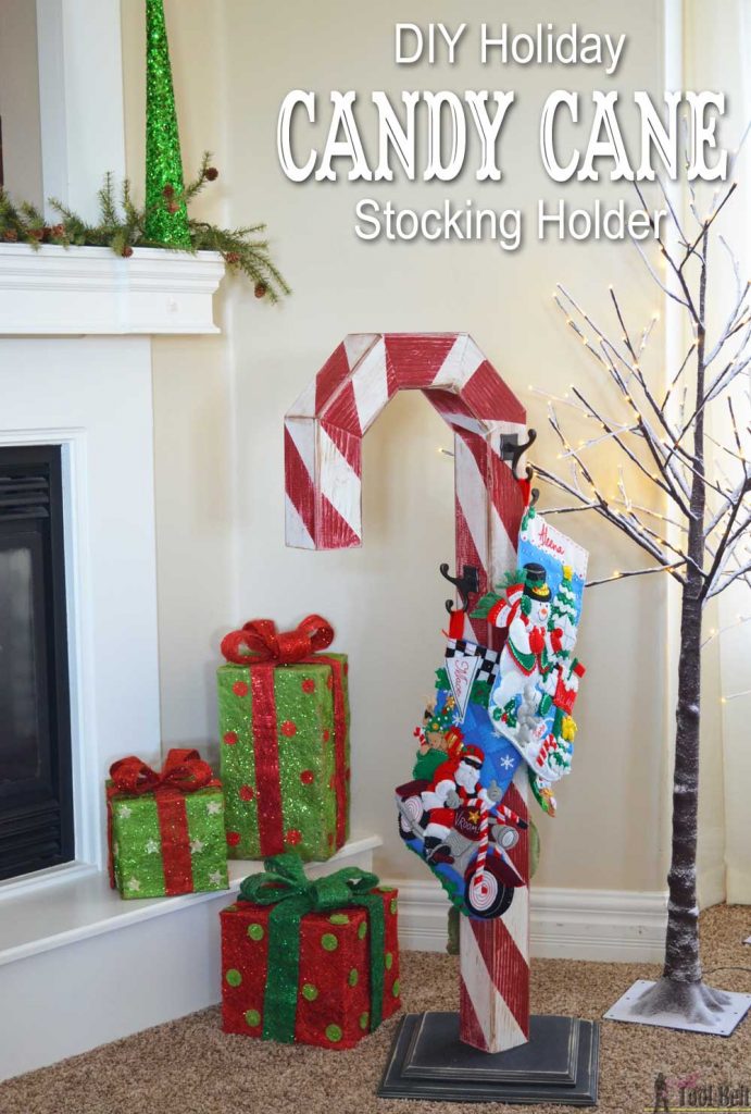 This is a perfect way to hang my Christmas stockings without a mantel! Free plans to build a DIY holiday Candy Cane stocking holder from a simple wood 4x4 post.