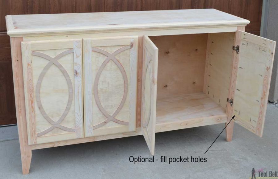 DIY Buffet or Sideboard with circle trim doors. This buffet cabinet boasts plenty of dining/kitchen supply storage. Free building plans.