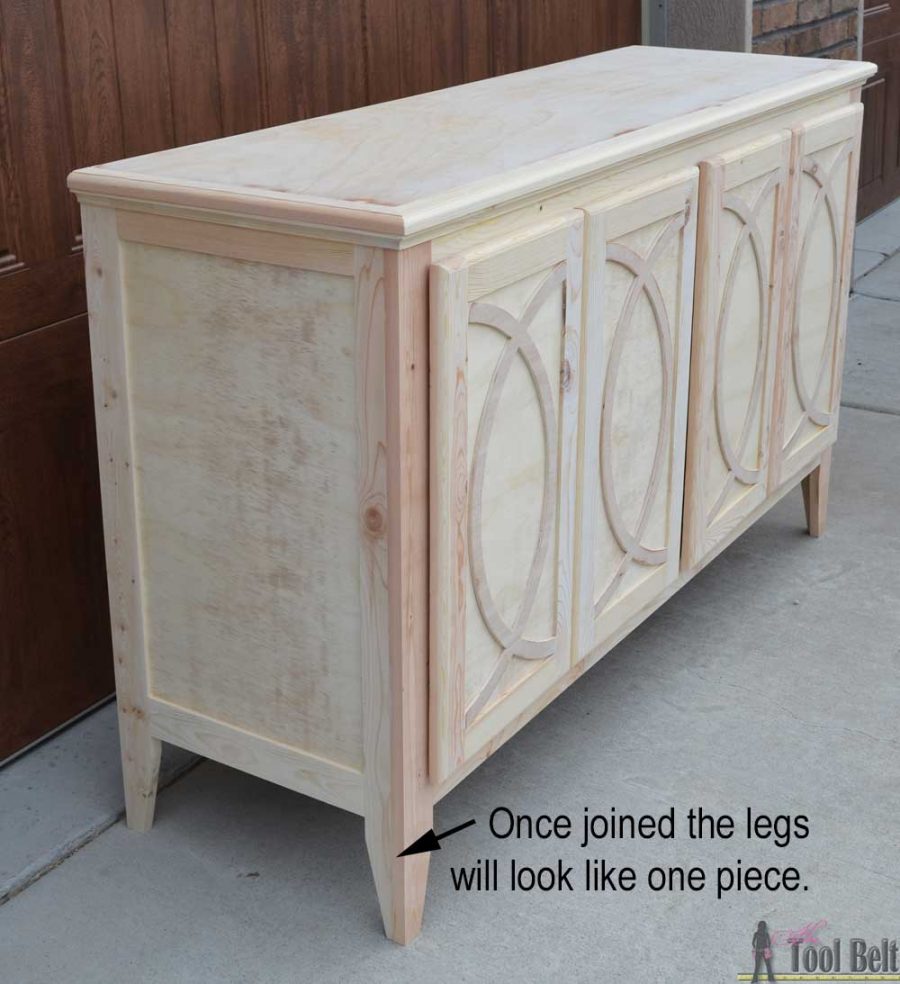 DIY Buffet or Sideboard with circle trim doors. This buffet cabinet boasts plenty of dining/kitchen supply storage. Free building plans.