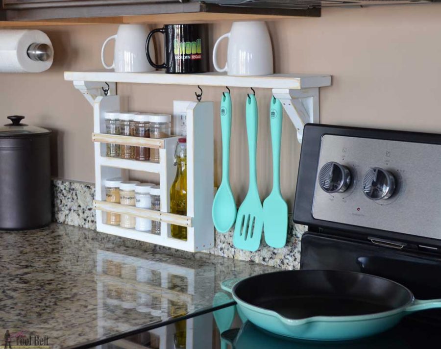 Clear the countertop clutter and have all of your essential kitchen gadgets organized and handy. Free plans and tutorial to build a DIY kitchen backsplash shelf and spice organizer.