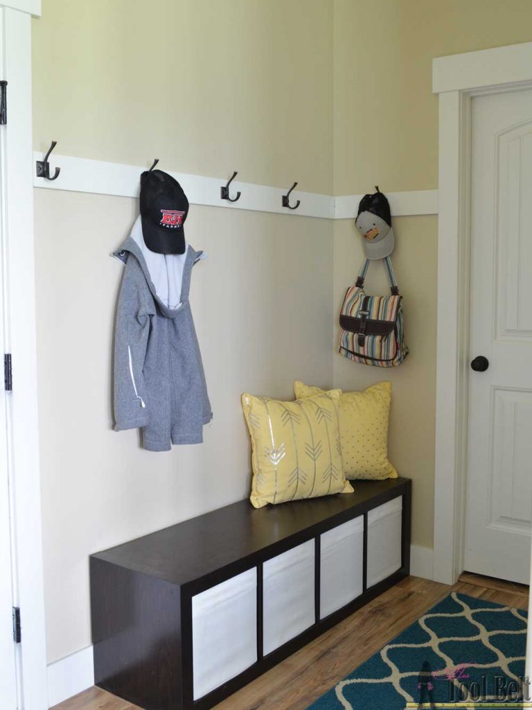 Mudroom before planked wall.