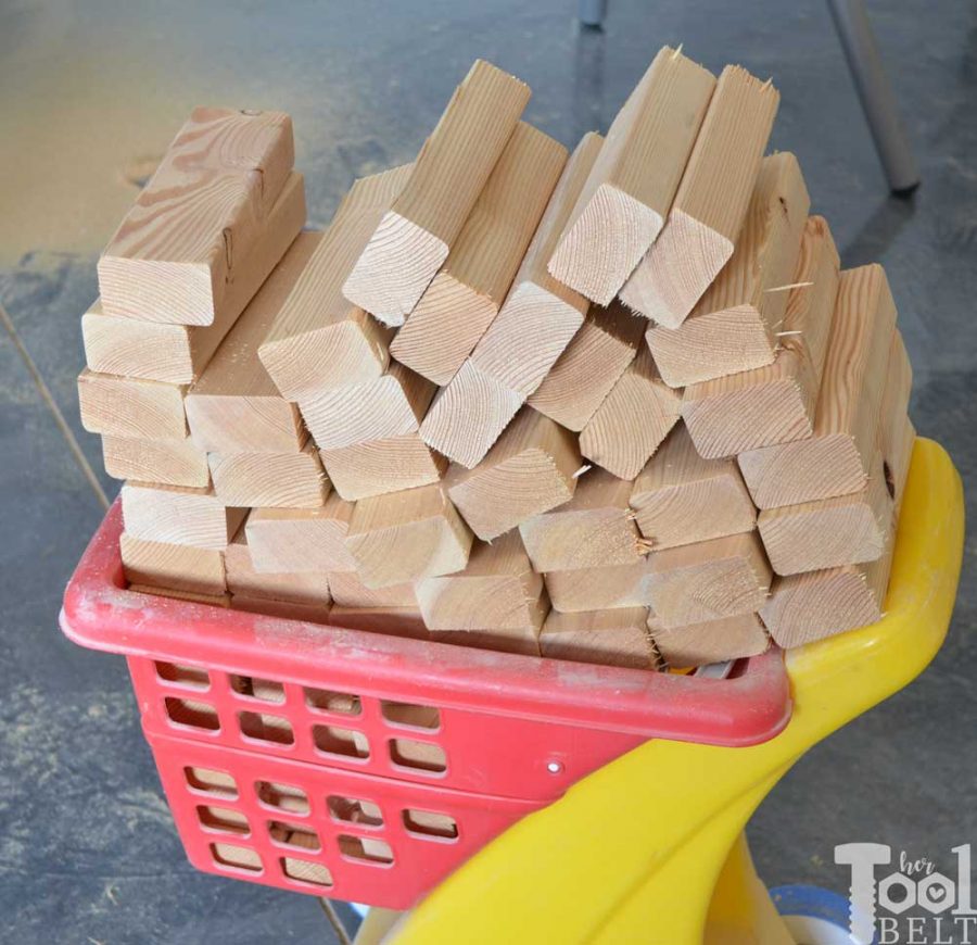 Pile of blocks. Make your own Giant Block Tower Builders yard game with a carrying crate that doubles as a playing stand. Add colored dice for a fun roll 'n go option to mix things up. 