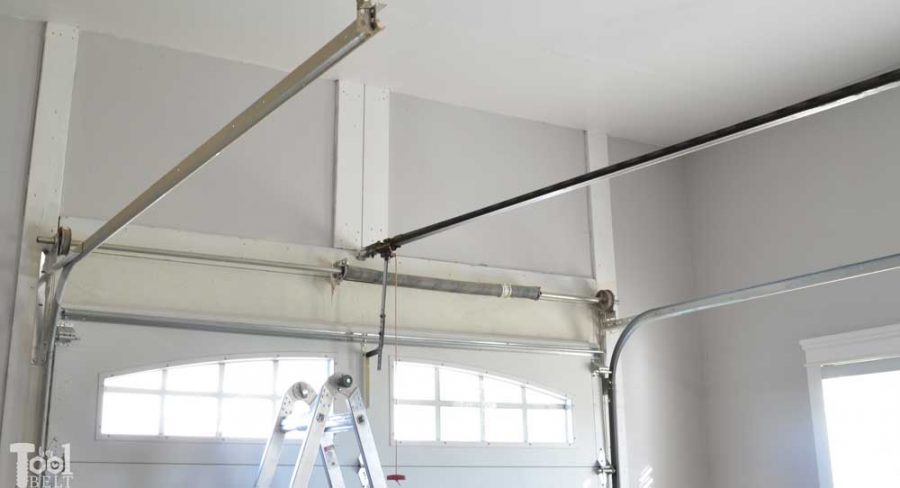 Take advantage of that empty space above your garage door. Build an overhead garage storage shelf perfect for seasonal storage items. 