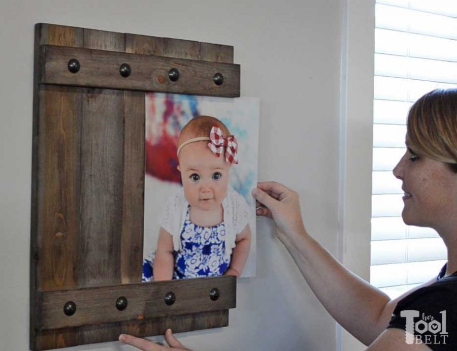 Change out your photo prints super easy with a sliding farmhouse style frame. Make these cute frames out of wood for as little as $5. Free plans