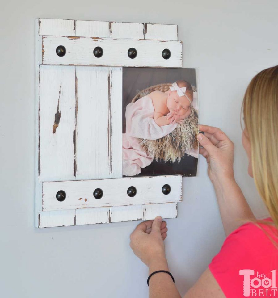 Change out your photo prints super easy with a sliding farmhouse style frame. Make these cute frames out of wood with free plans