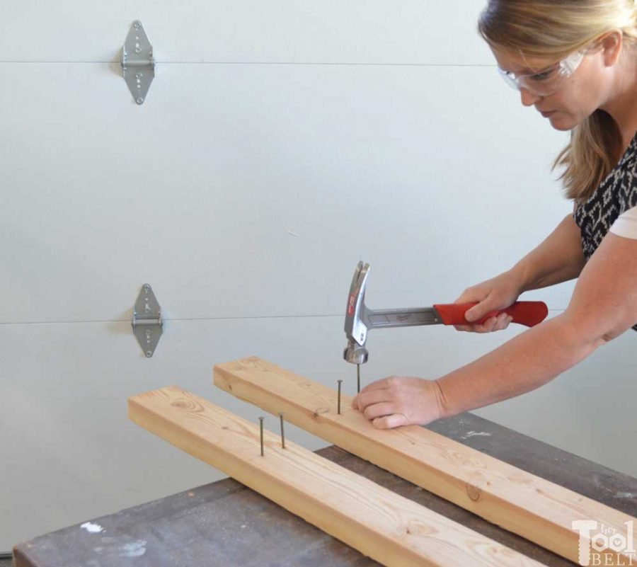 Take advantage of that empty space above your garage door. Build an overhead garage storage shelf perfect for seasonal storage items. 