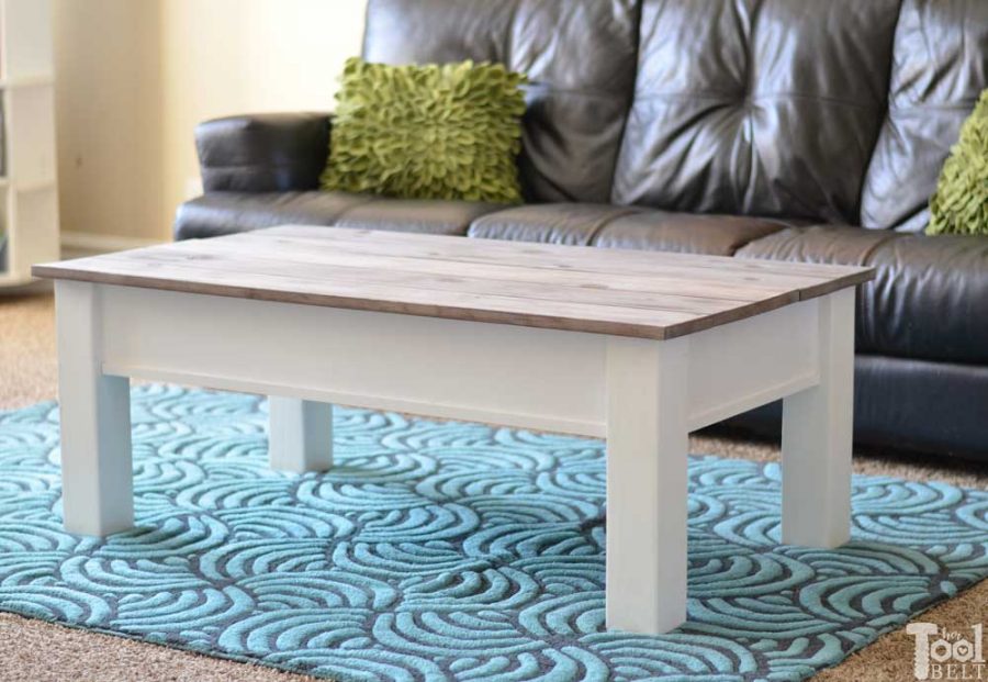 Simple farmhouse style coffee table with weathered wood top. This coffee table has a hidden gem, flip open the top for lots of storage space. Free plans