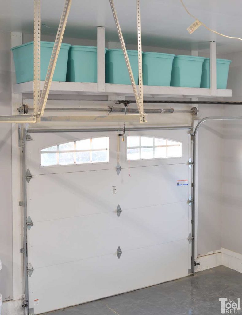 Take advantage of that empty space above your garage door. Build an overhead garage storage shelf perfect for seasonal storage items. Free plans