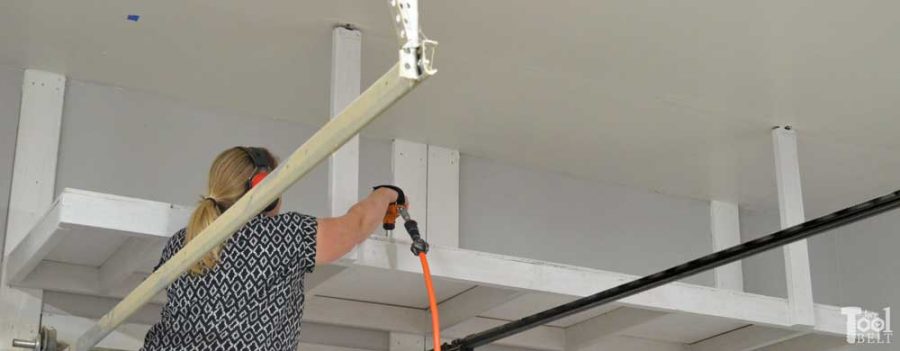 Take advantage of that empty space above your garage door. Build an overhead garage storage shelf perfect for seasonal storage items. 