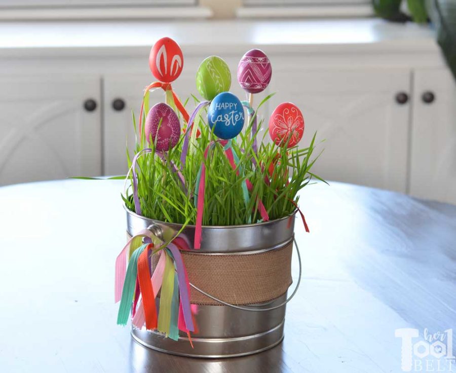 Make a cute and easy Easter centerpiece with engraved eggs. Perfect for spring or Easter egg decor.