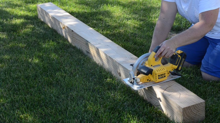 Fixing the sagging deck, cutting new deck posts with circular saw.