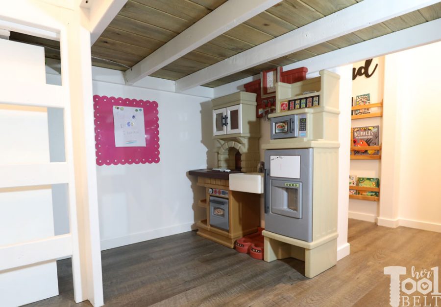 This Mom built a basement playhouse for her kids. It's really a toy room shaped like a modern farmhouse tiny house...come take a tour.