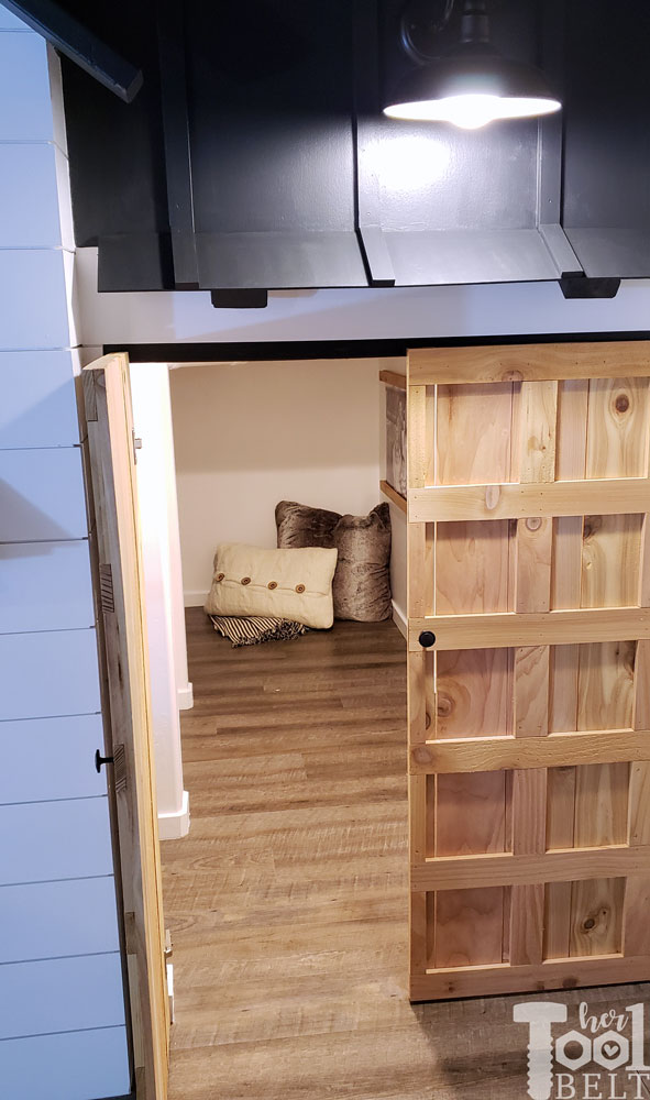 This Mom built a basement playhouse for her kids. It's really a toy room shaped like a modern farmhouse tiny house...come take a tour.