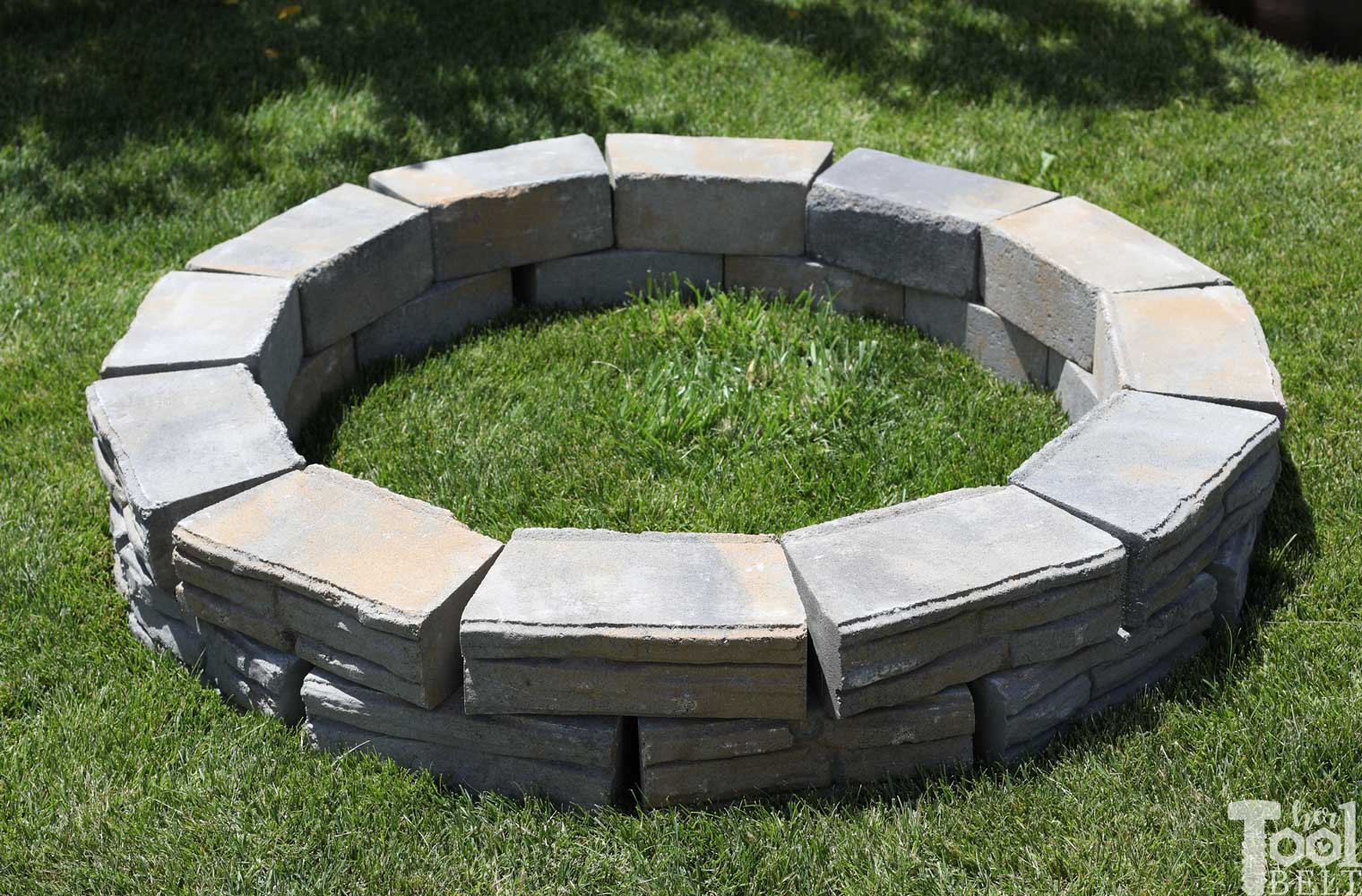 https://www.hertoolbelt.com/wp-content/uploads/2019/06/diy-backyard-fire-pit-blocks-before.jpg