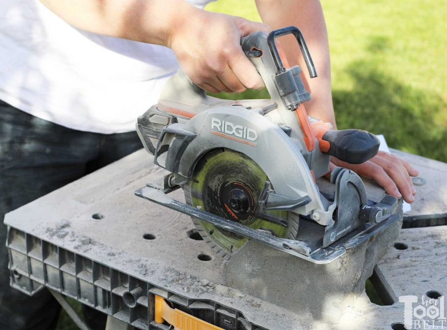 Ridgid circular saw with masonry bit to cut blocks to fit 36" fire ring circle - How to build a DIY backyard firepit with wall blocks from Home Depot. 