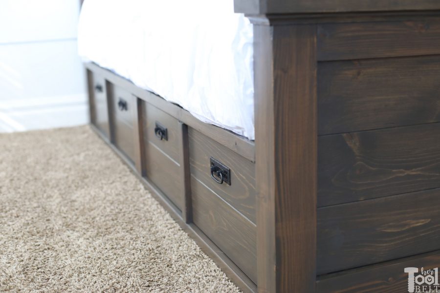 Build a barn door farmhouse bed with X headboard. Free king size bed building plans on hertoolbelt.com.