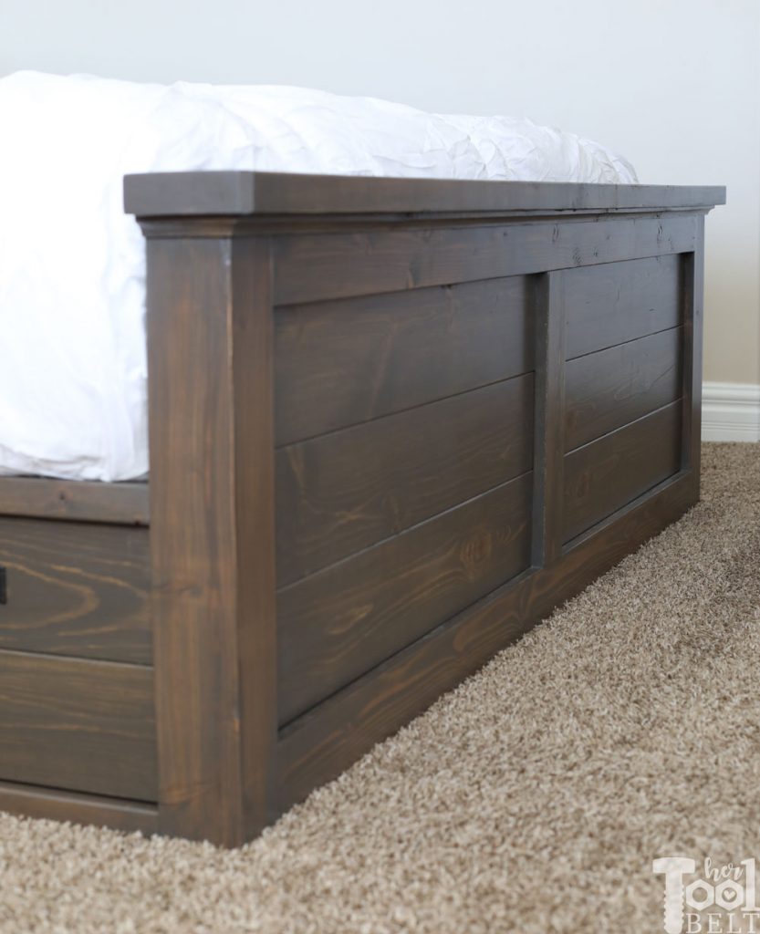 Build a barn door farmhouse bed with X headboard. Free king size bed building plans on hertoolbelt.com.