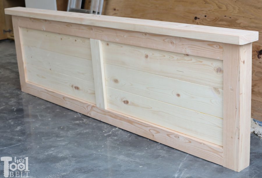 Build a barn door farmhouse bed with X headboard. Free king size bed building plans on hertoolbelt.com.