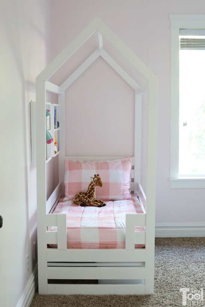 Free plans to build a house frame toddler bed with under the bed storage bins.