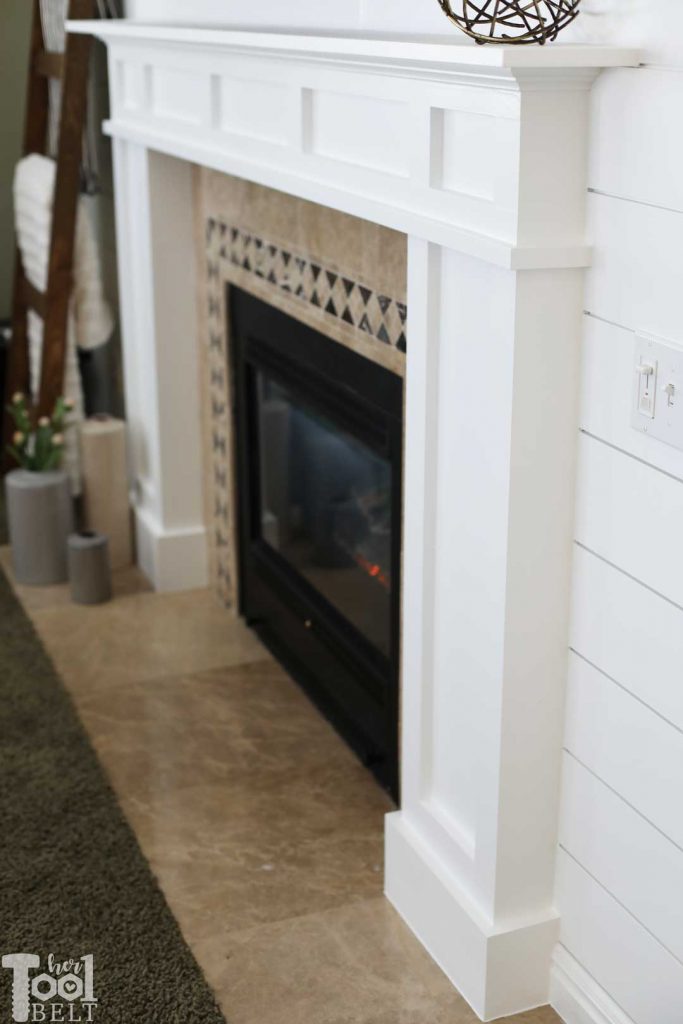 DIY modern white craftsman fireplace mantle and shiplap wall.