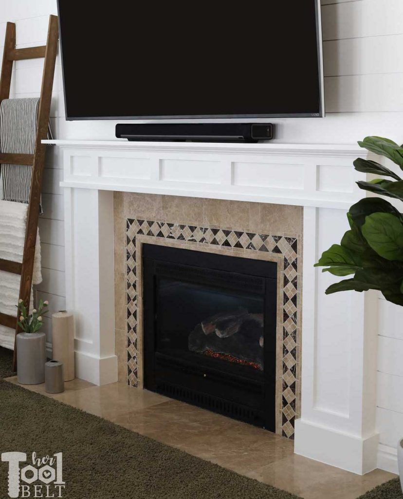 DIY modern white craftsman fireplace mantle and shiplap wall.