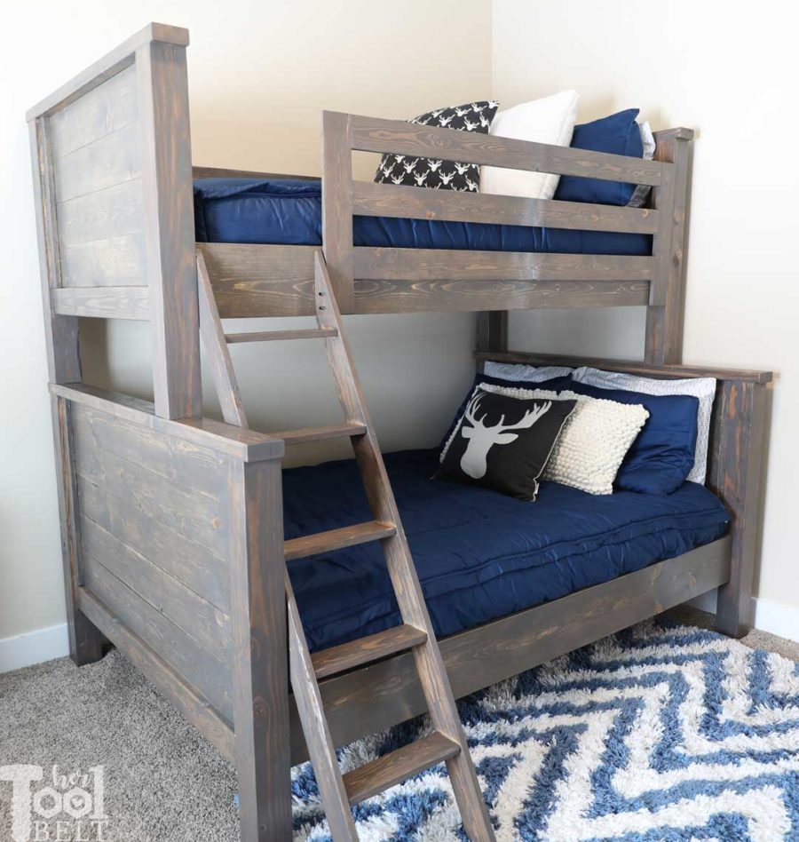 Save space in your kid's bedroom. Free plans to build a farmhouse style twin over full bunk bed. Navy boys room and Deer pillows