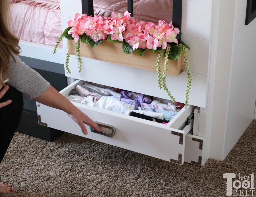 Build a super fun twin bunk bed that looks like a tiny house. Add tons of storage with under the bed drawers. Free plans on hertoolbelt.com